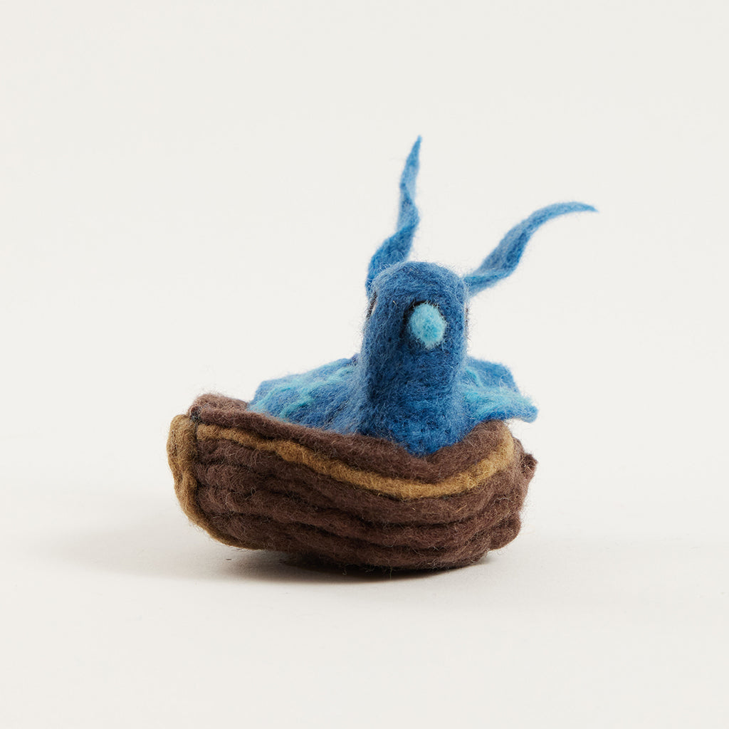 Oiseau bleu dans son nid avec des œufs Ornement